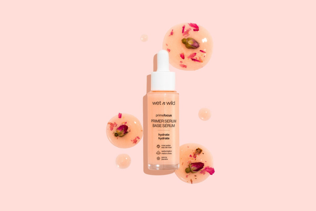 Wet n wild | Prime Focus Hydrating Primer Serum | Products displayed besides a floral arrangement
