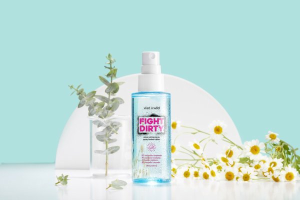 Wet n wild | Fight Dirty Detox Setting Spray | Product front facing cap off, with floral background
