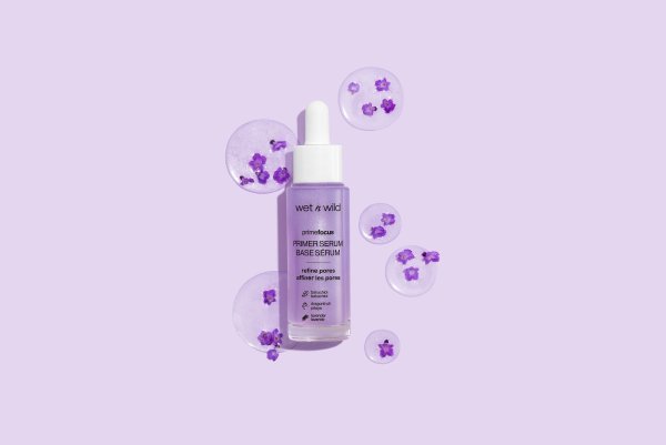 Wet n wild | Prime Focus Pore Minimizing Primer Serum | Product front facing lid closed, with floral background