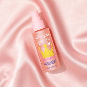 Wet n wild | Pampered Illuminating Face Mist | Product front facing lid closed, with fabric background