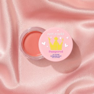 wet n wild | Lip Scrub front facing with open lid on a silky pink background