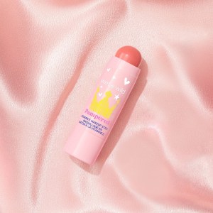 Wet n wild | Pampered Vitamin E Makeup Stick- Good To Be Me | Product front facing cap off, with pink satin background